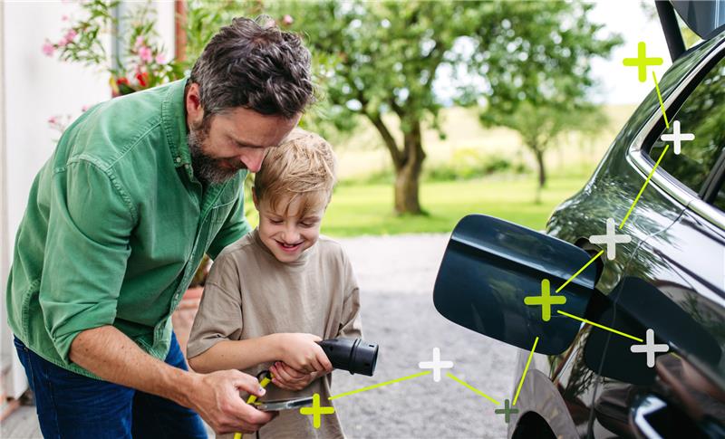 Father Charging EV with his son